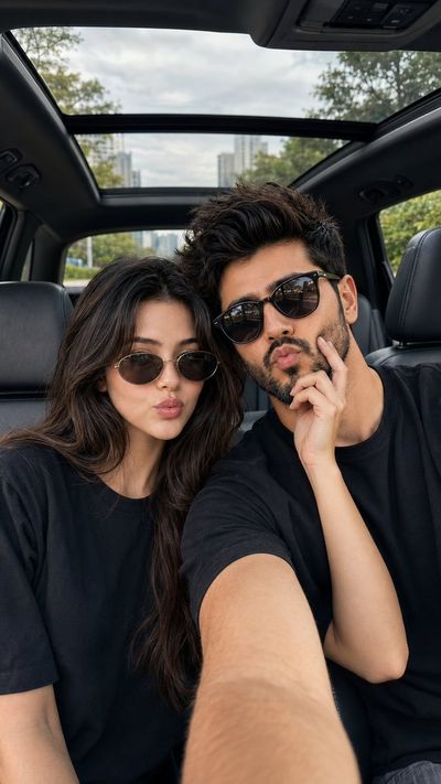Young couple shares a playful pout inside a luxury car
