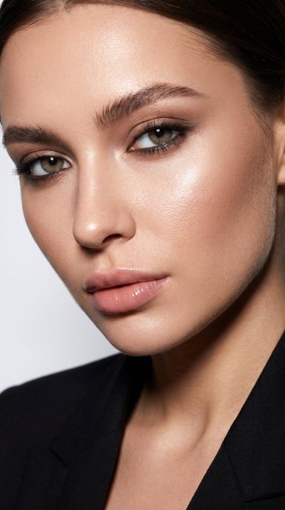 Luxury editorial makeup enhances facial symmetry and skin texture