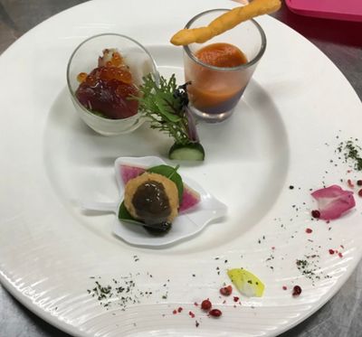 Golden croquette with rich sauce and fresh seafood garnishes
