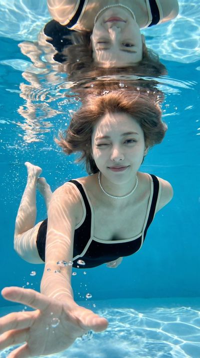 Captivating Underwater Portrait of an East Asian Woman