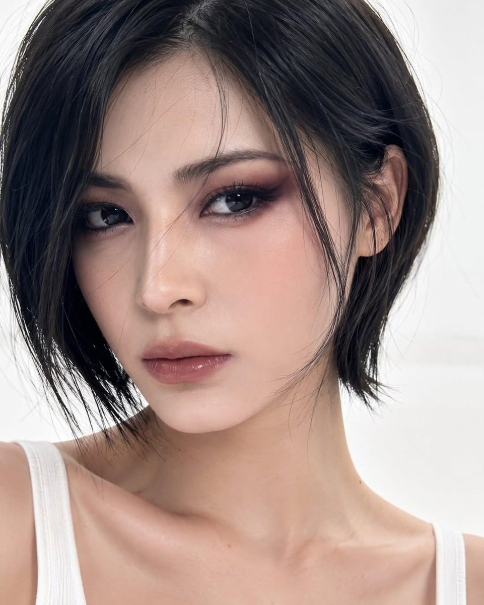 Elegant Korean-inspired short bob shines under soft studio lighting.