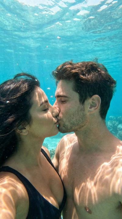 A Tender Underwater Kiss: Realistic Intimacy in Turquoise Waters