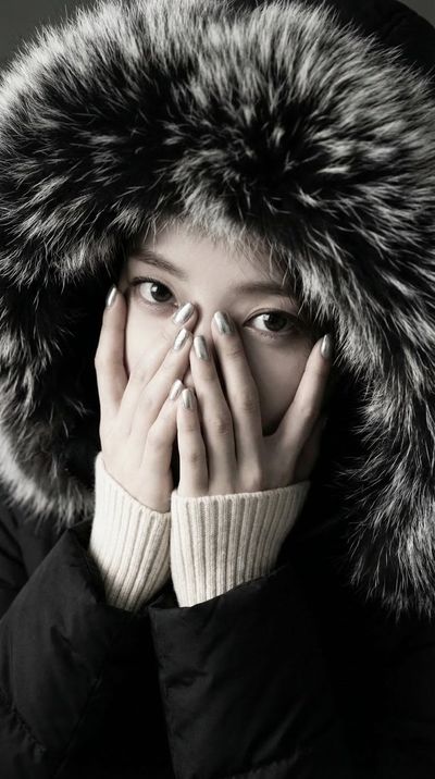 Doe-Eyed Winter Gaze Above the Fur Cocoon