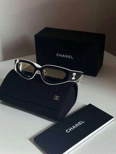 Young woman takes a playful selfie in black sunglasses