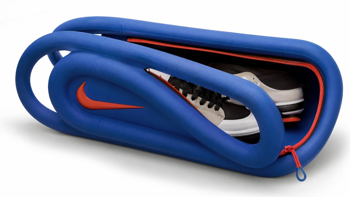 Thick rubber tubing bends into a precise corporate logo shape