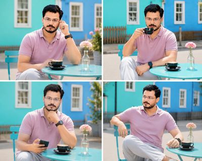 Man in pastel pink polo enjoys coffee at turquoise café