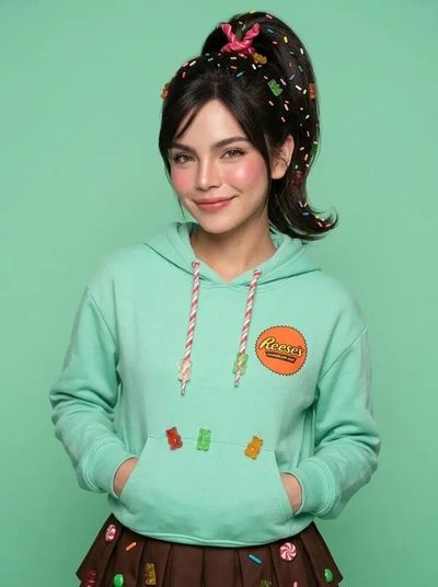 Sofia wears a lavender gown with a jeweled tiara in a studio portrait