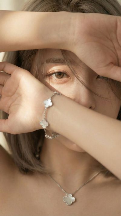 Embracing Fortune with Silver Clovers