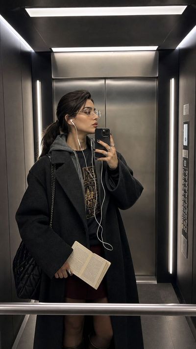 Candid Reflection: A Stylish Elevator Selfie