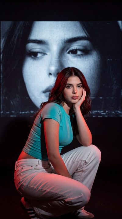 Contrasting Realities: Portrait with Turquoise and VHS Projection