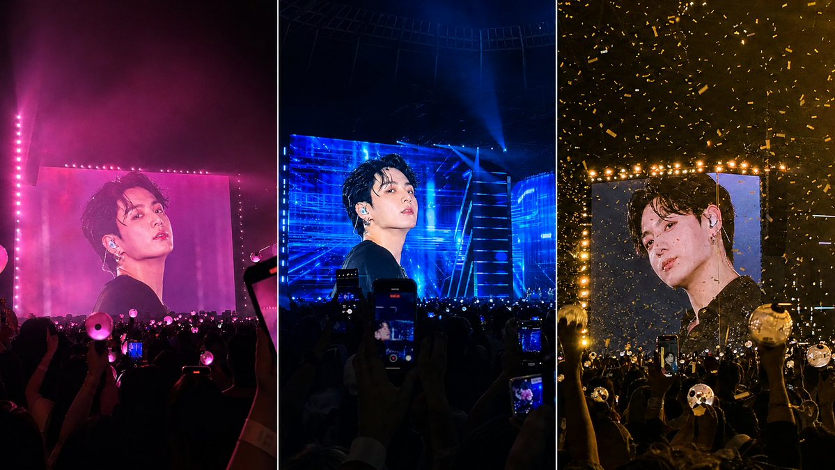 A K-pop idol appears on giant LED screens in a packed arena