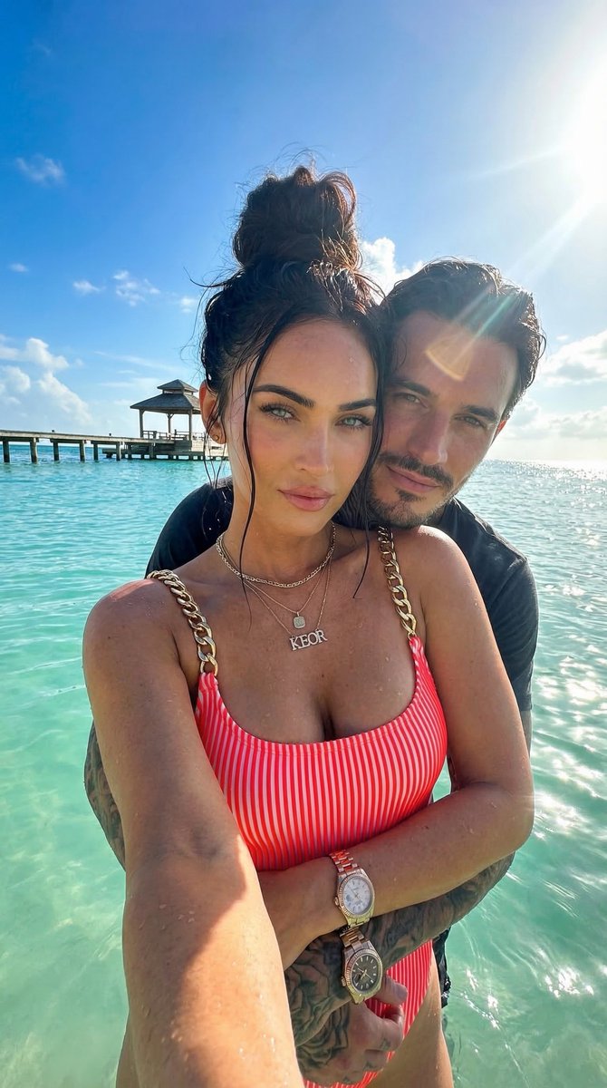 Megan Fox poses in neon swimsuit at tropical beach selfie