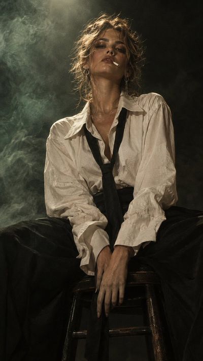 Smoldering Woman with Cigarette Sits on Stool in Smoky Cabaret Noir