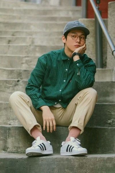 Contemplative Youth on Urban Concrete Steps