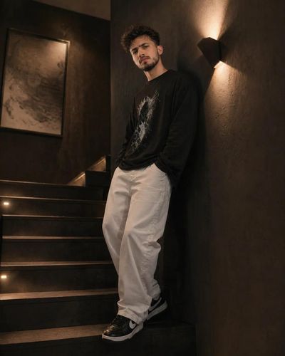 Moody Wide-Angle Portrait in Black Apartment