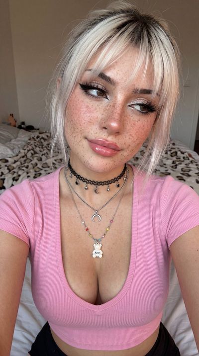 Freckled Glamour: Intimate Close-Up Selfie with Layered Jewelry