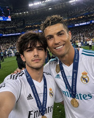 Ecstatic fan snaps selfie with star player on stadium pitch