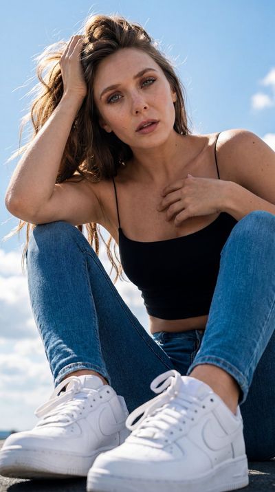 Sunlit Jennifer Lawrence lookalike gazes upward from low angle