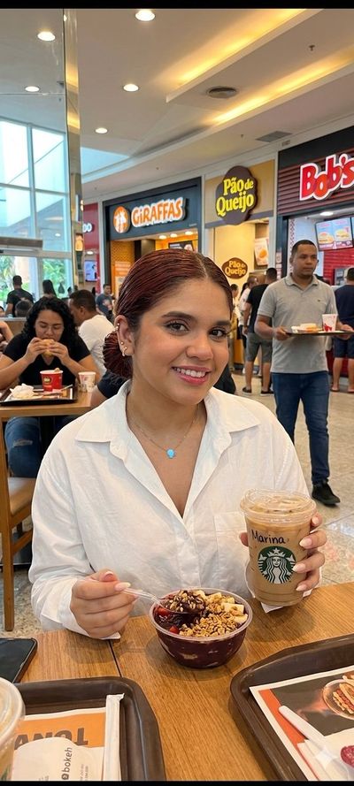Casual Coffee Moment in a Busy Mall